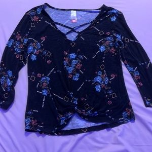No boundaries 3/4 sleeve black with floral design top.